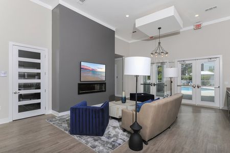 Seating area with couch and tv in lobby of main building